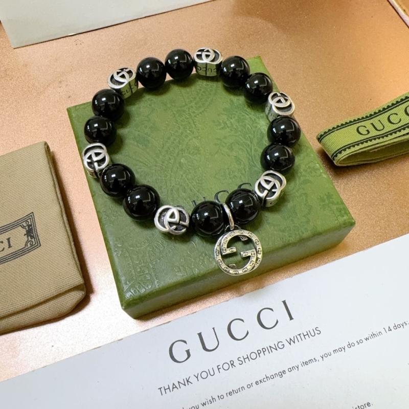 G*u*i bracelets